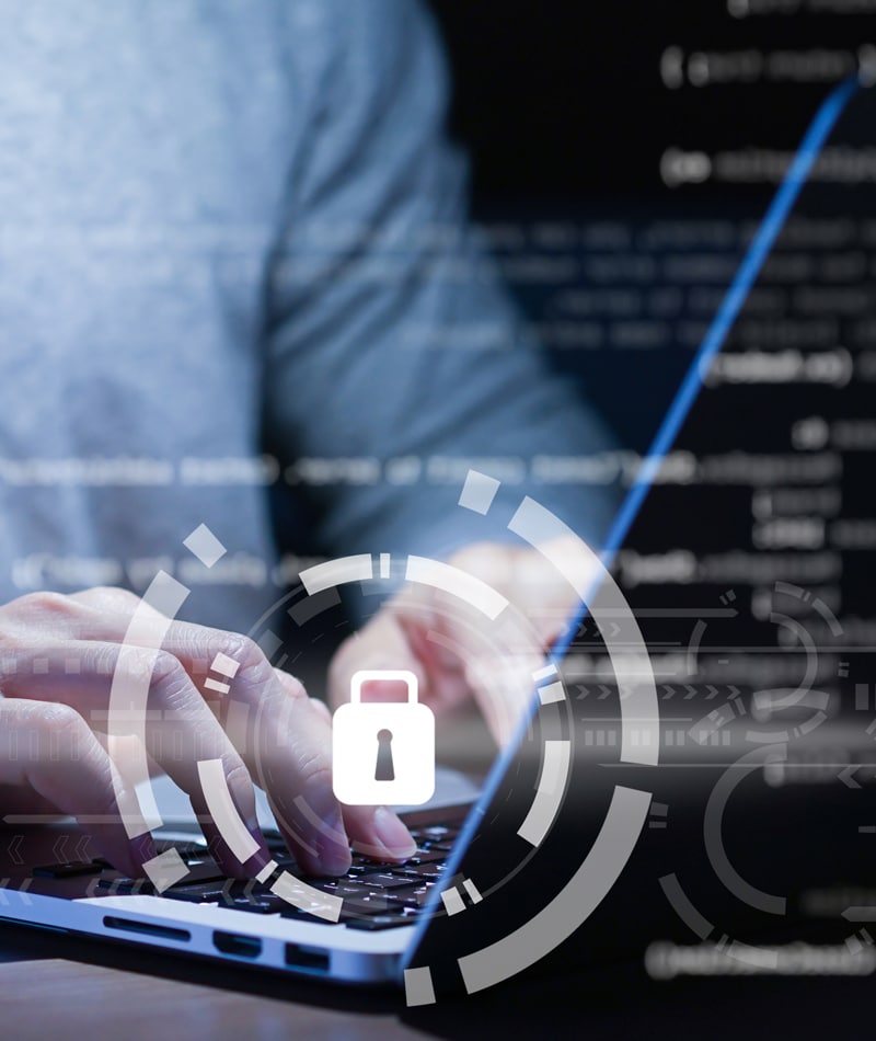 A close up of hands typing on a keyboard with a lock overlay, signifying cybersecurity services in Cypress.