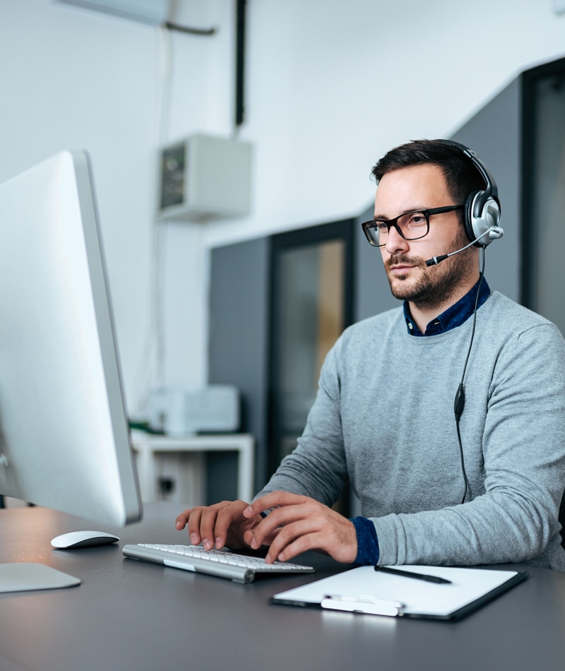 Close up of an IT support specialist providing remote support for a client.