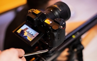 A close up of a camera being used to record video marketing content.