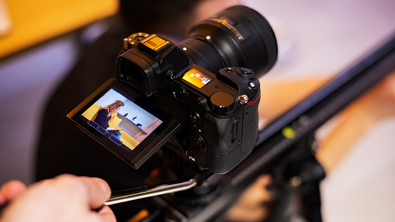 A close up of a camera being used to record video marketing content.